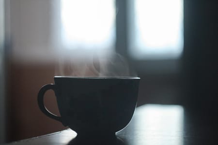 Cup of fresh, steaming hot coffee